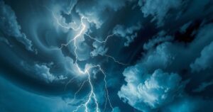 A dark stormy sky with swirling clouds and lightning, showcasing the turbulence before a storm in Kentucky.