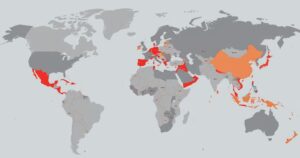 A world map highlighting affected countries in muted tones, showing travel restrictions with no human presence.