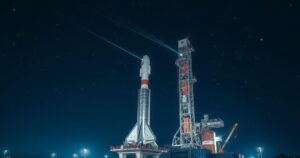 SpaceX Falcon 9 rocket on launch pad with a starry night sky in the background.