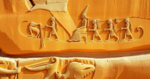 Ancient Egyptian rock carving depicting a boat scene, showcasing early rulers and their significance in history.